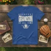 Blue t-shirt with "GREATEST GRANDSON OF ALL TIME" text and a dog graphic in a laurel wreath