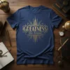 Navy blue t-shirt with gold Art Deco design featuring the text "GREATNESS Has Arrived..."