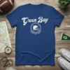 Blue t-shirt with "Green Bay" text and a football helmet graphic in a circle, representing football team spirit