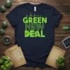 Green New Deal text design with wind turbines, circuit board pattern, and leaf graphics on a navy t-shirt