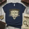 Greensboro Est. 1808 North Carolina text design on a navy t-shirt with a vintage crest and tree graphic