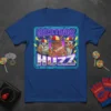Greetings Huzz T-Shirt featuring three cats wearing baseball caps and holding lollipops with retro neon border and text