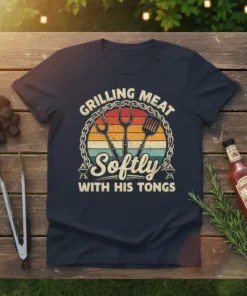 Grilling Meat Softly With His Tongs t-shirt featuring barbecue tools and a sunset graphic
