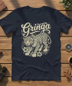 Navy t-shirt with "Gringa" text above a detailed jaguar illustration with floral elements, cream-colored design