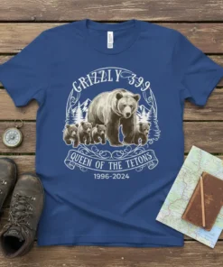 Grizzly 399 and cubs t-shirt design, featuring text "Grizzly 399 Queen of the Tetons 1996-2024" and mountain scenery