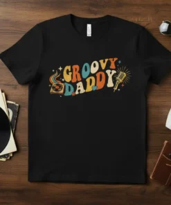 Groovy Daddy text design with retro record player and microphone graphics on a black t-shirt