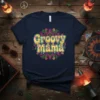 Groovy Mama text in a dripping, retro font surrounded by a colorful mandala design on a navy t-shirt