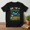 Pixel art "Grow A Garden" text with Minecraft-inspired gardening graphics on a black t-shirt