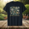 T-shirt with "growth. not perfection." quote and a square floral illustration featuring dandelions and daisies
