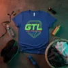 Blue t-shirt with "GTL GYM TAN LAUNDRY" in green and orange neon circuit board design