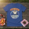 Guess What? Chicken Butt! text design with a cartoon chicken wearing aviator goggles, on a royal blue t-shirt