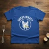 Blue t-shirt with white text "GUESS WHAT?" above a geometric German Shepherd design