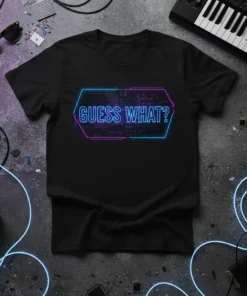Black t-shirt with "Guess What?" in neon blue and pink geometric design, featuring circuit board patterns