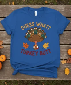 Guess What Turkey Butt funny Thanksgiving t-shirt with a cartoon turkey upside down and autumn leaves