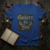 Gothic "Guilty AS Sin" text design with thorny roses and skeletal hands on a blue t-shirt