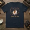 Guinea Pig Love t-shirt design featuring a cute guinea pig wearing goggles and a bow tie, surrounded by a heart-shaped