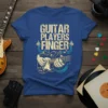 Guitar Players Finger T-Shirt design featuring text and a hand playing an electric guitar with musical notes