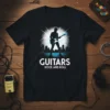 Black t-shirt with "GUITARS ROCK AND ROLL" text and silhouette of a guitarist in front of a cityscape