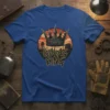 Gulag King text with a crown graphic and a silhouette of a gulag in the background on a blue t-shirt