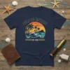 Gulf of Mexico Est 1550 retro sunset graphic t-shirt with palm trees, ocean waves, and a dolphin