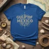 Gulf of Mexico Est 1550 text with a vintage compass graphic on a blue t-shirt