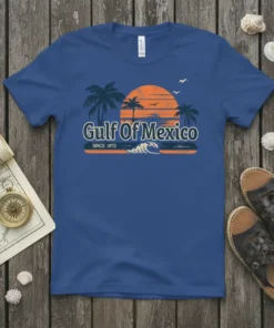 Gulf Of Mexico SINCE 1872 text with retro sunset, palm trees, and ocean wave graphic on a blue t-shirt