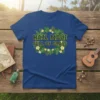 Blue t-shirt with "Hail Maui Full Of Grass" text surrounded by tropical leaves and yellow flowers