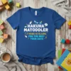 Hakuna Matoddler It Means No Relaxing For The Rest Your Days quote on a blue t-shirt with baby bottle and