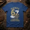 Hands 67 Cupping Something t-shirt design featuring vintage gears and a hand. Includes distressed text for a retro mechanic look