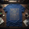 Blue t-shirt with gold text "Hang On Let Me Overthink This" in ornate frame, featuring gears and brain graphic