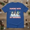 Hangin' With My Snowmies text with three cute snowmen graphic on a blue t-shirt for Christmas