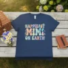 Happiest Mimi On Earth text with butterflies and floral accents on a navy blue t-shirt