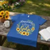Happiness is Being a Gigi text with a sunflower wreath design on a blue t-shirt