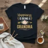Happiness is Being a Grandma quote with floral arrow design on a dark t-shirt