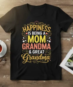 Happiness is Being a Mom Grandma & Great Grandma quote on a black t-shirt with colorful typography and floral accents