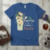 Happiness is Being a Nona t-shirt with floral bouquet and baby footprints design