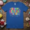 Happy Birthday To You text design with colorful balloons, confetti, and fireworks graphic on a royal blue t-shirt
