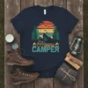 Happy Camper t-shirt with retro sunset, pine trees, mountains, and birds graphic