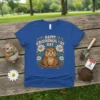 Happy Groundhog Day text with a cute groundhog and daisies graphic on a blue t-shirt