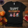 Happy Hallothanksma text with three gnomes holding Boo sign, candy cane, and dressed for holidays on black t-shirt