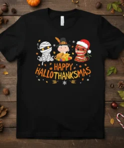 Happy Hallothanksmas text with cute mummy, pilgrim, and Santa characters on a black t-shirt