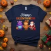 Happy Hallowthanksma text with a purple monster, scarecrow, and Santa Claus graphic on a navy blue t-shirt