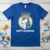 Happy Hanukkah Unicorn T-Shirt with a white unicorn wearing a menorah crown and the text "Happy Hanukkah"