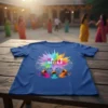 Happy Holi text with a colorful powder splash and small pots of pigment on a blue t-shirt