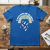Blue t-shirt with "If You're Happy And You Know It It's Your Meds" text and rainbow design with falling pills