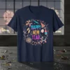 Happy New Year text with festive party graphics including balloons, champagne, and confetti on a navy t-shirt