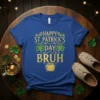 Happy St. Patrick's Day Bruh text with shamrocks and pot of gold graphic on a blue t-shirt