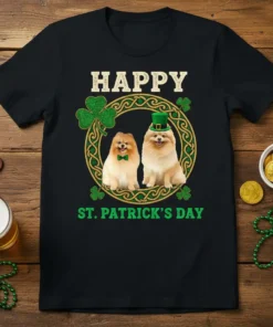 Happy St. Patrick's Day Pomeranian T-Shirt with two dogs wearing festive hats and bows, surrounded by shamrocks and Celtic knot