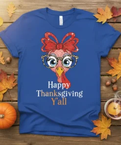 Happy Thanksgiving Y'all text with a cute cartoon turkey wearing glasses and a bow on a blue t-shirt