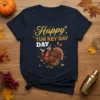 Happy Turkey Day text with a cartoon turkey holding a martini glass, on a navy t-shirt